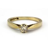A 9ct yellow gold brilliant cut diamond set solitaire ring, (G).