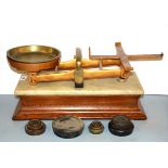A Victorian oak marble and brass scale and weights, L. 49cm.