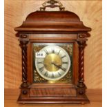 An oak bracket clock, H. 43cm.