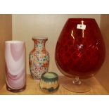 A large ruby glass brandy glass shaped vase, a further 1970's vase and two ceramic items, brandy