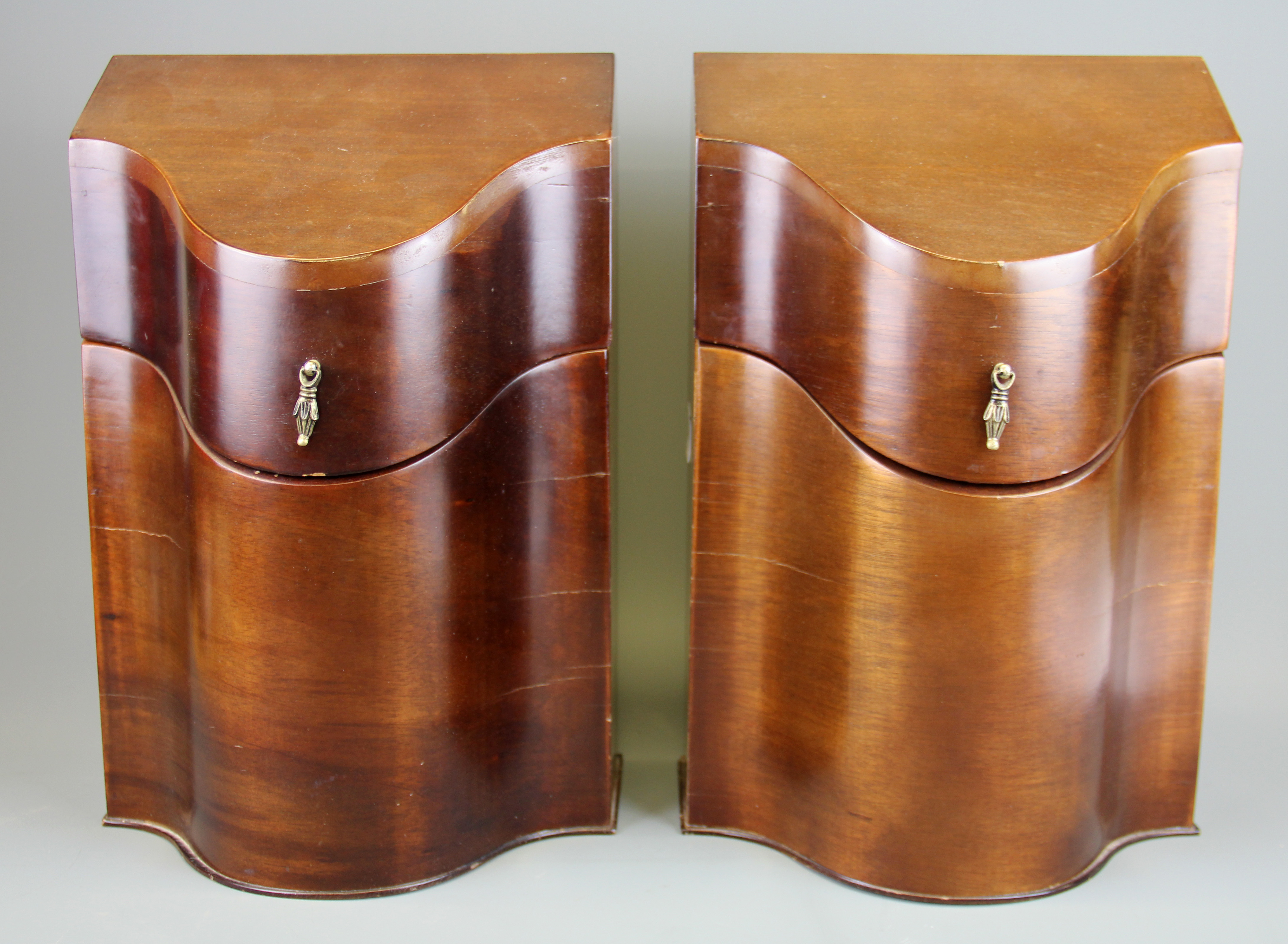 A pair of reproduction mahogany veneered knife boxes, H. 36cm.