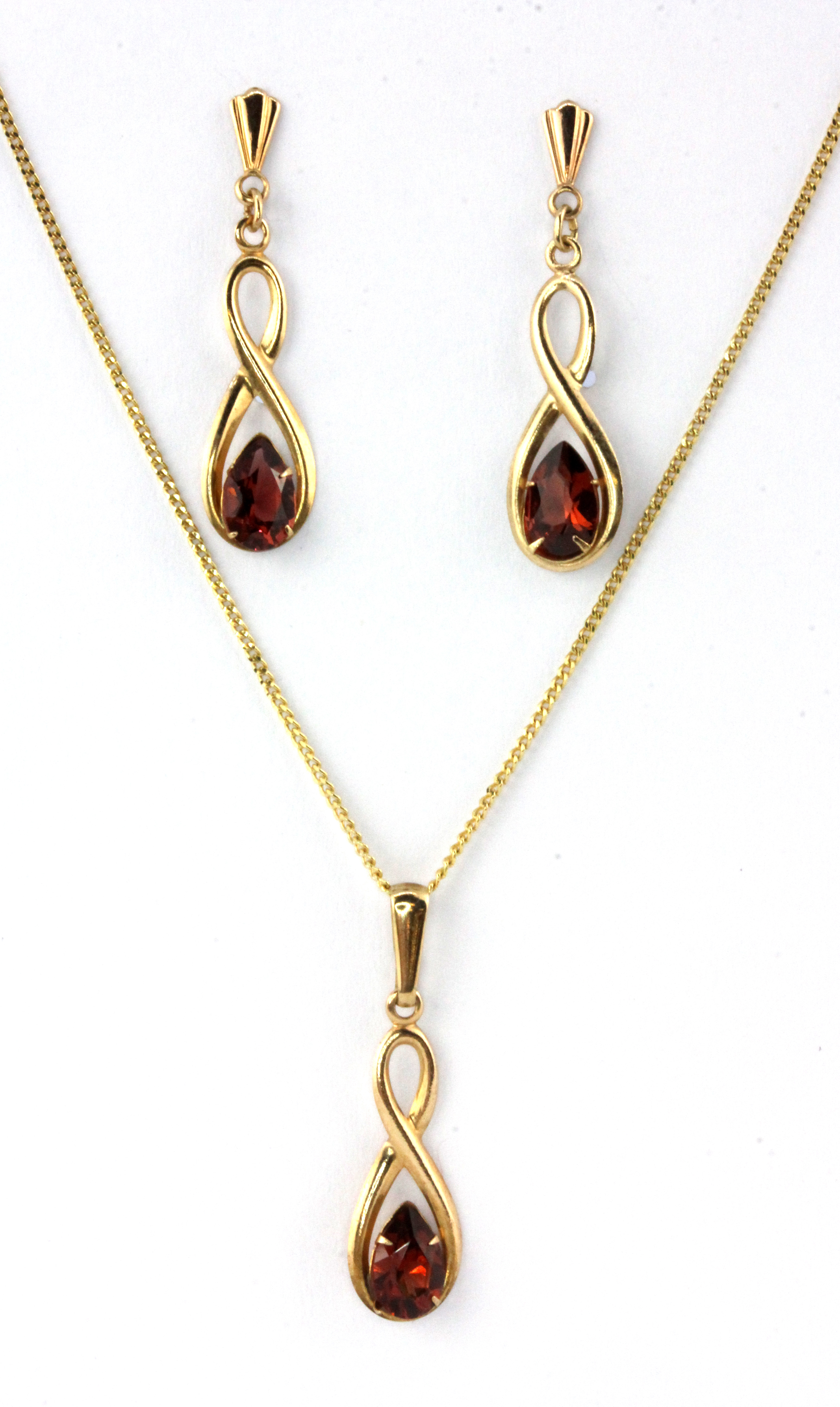 A pair of 9ct yellow gold topaz set earrings and matching pendant and chain, L. 2cm, (one