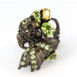 A Hana Maae designer 925 silver gilt ring in the shape of a fantail fish, set with peridot, citrines