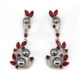 A pair of 925 silver drop earrings set with marquise cut rubies and black pearls, L. 4cm.