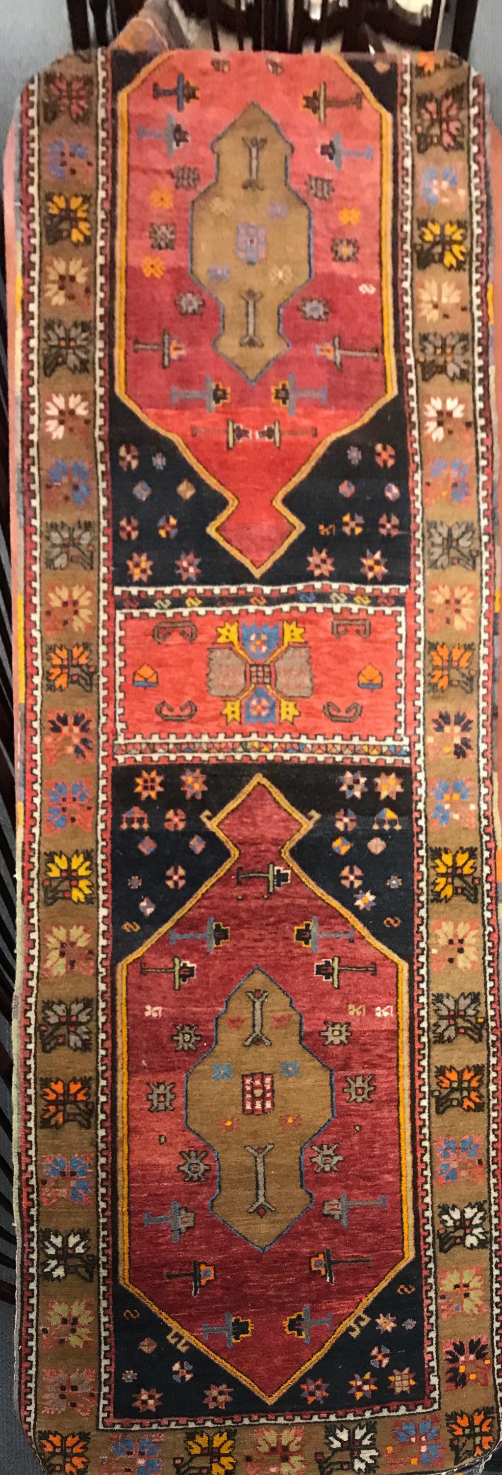 A handwoven Turkish wool rug, size 98 x 300cm.