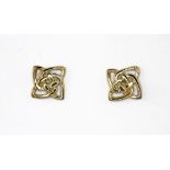 A pair of 9ct yellow gold stud earrings, L. 0.6cm.