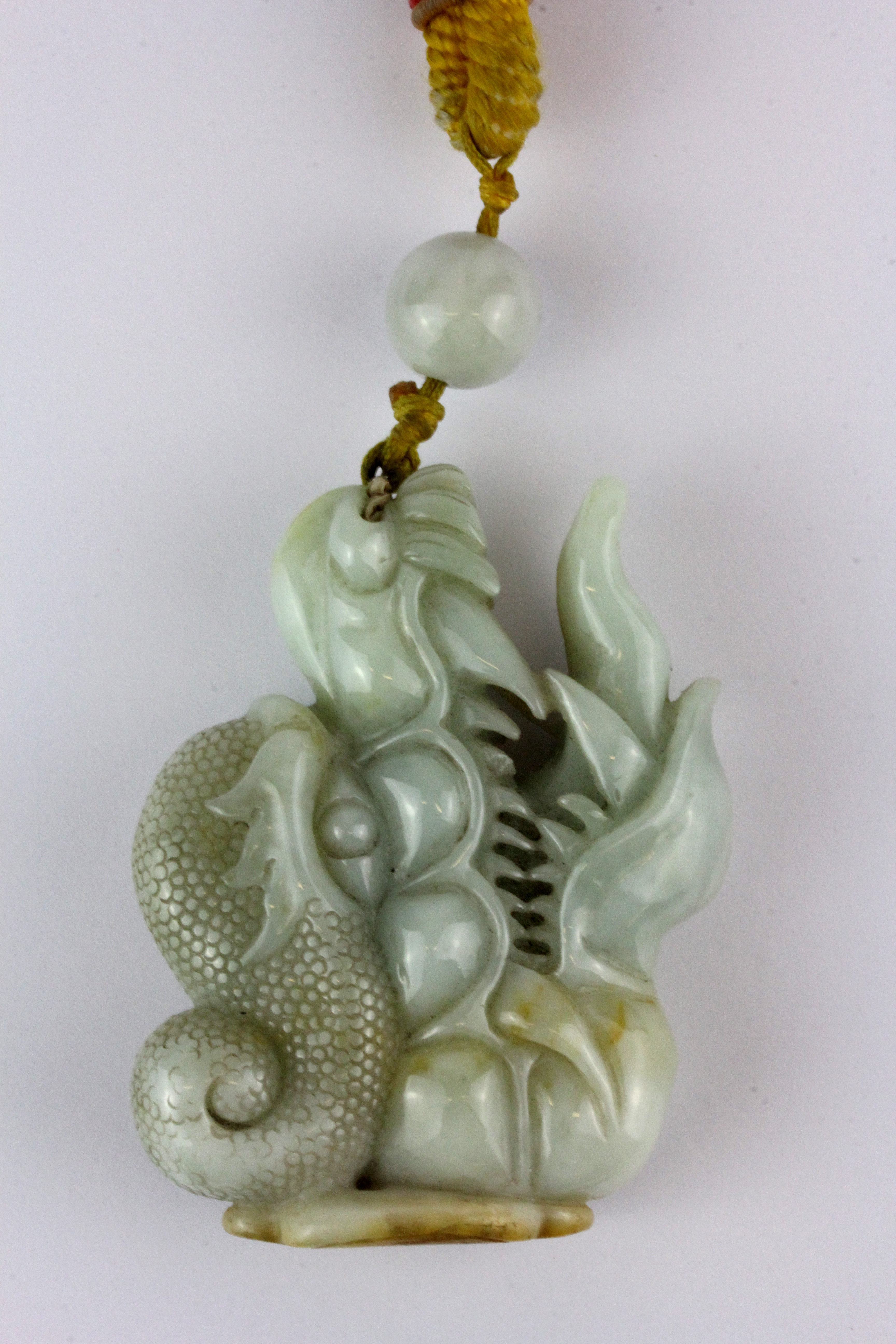 A superb 19th Century Sino-Tibetan carved jade protective amulet with Tibetan yellow silk carrying - Image 3 of 3