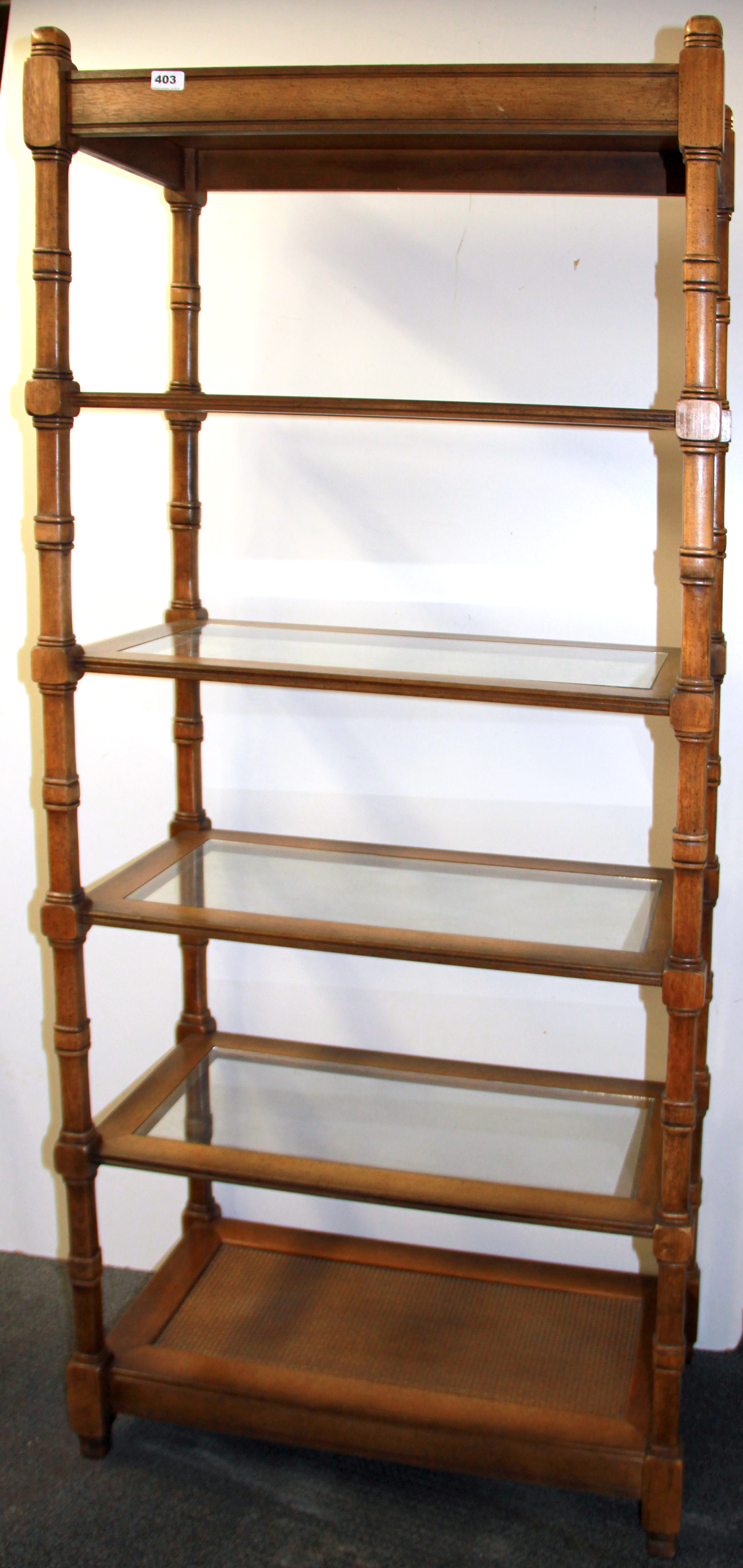 A useful wood and glass display stand, W. 76cm H. 183cm.