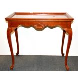 A mahogany silver table with two slides, size 77 x 47 x 66cm.