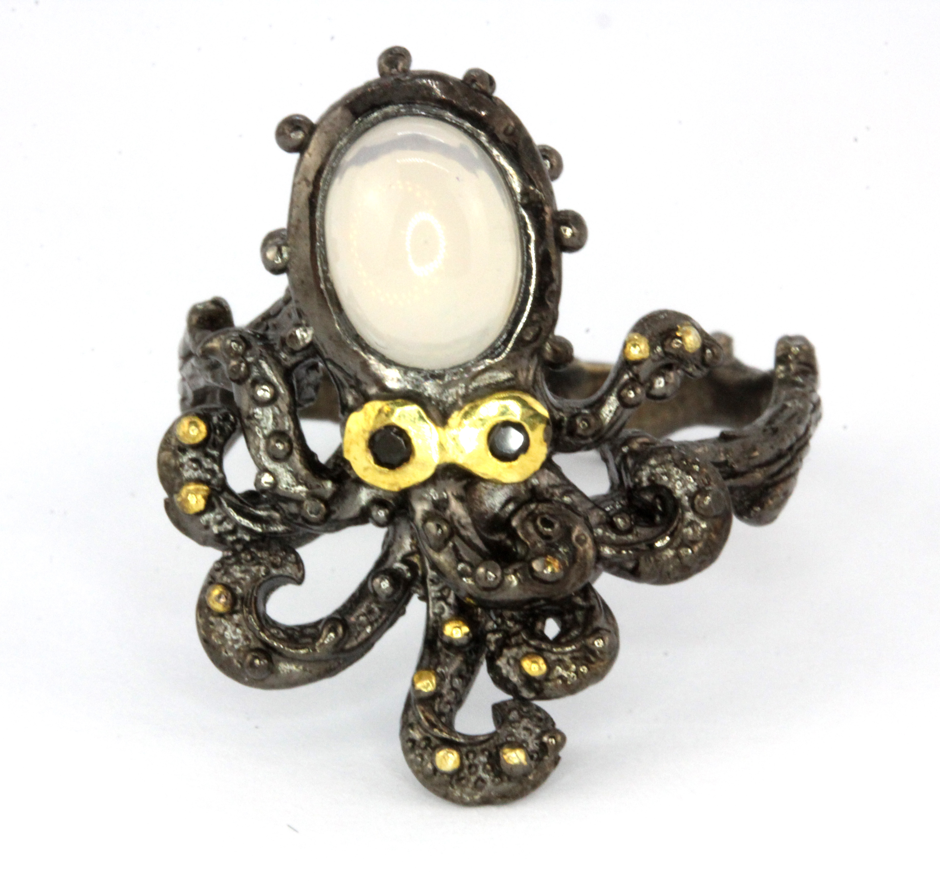 A Hana Maae designer 925 silver gilt octopus shaped ring set with opal and sapphire set eyes, (Q).