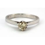 An 18ct white gold brilliant cut diamond set solitaire ring, (O).