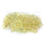 Approximately 250 unmounted round cut fancy yellow diamonds, approx. 3ct, 1.3mm dia.