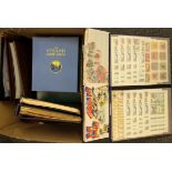 A box of mixed stamp albums.