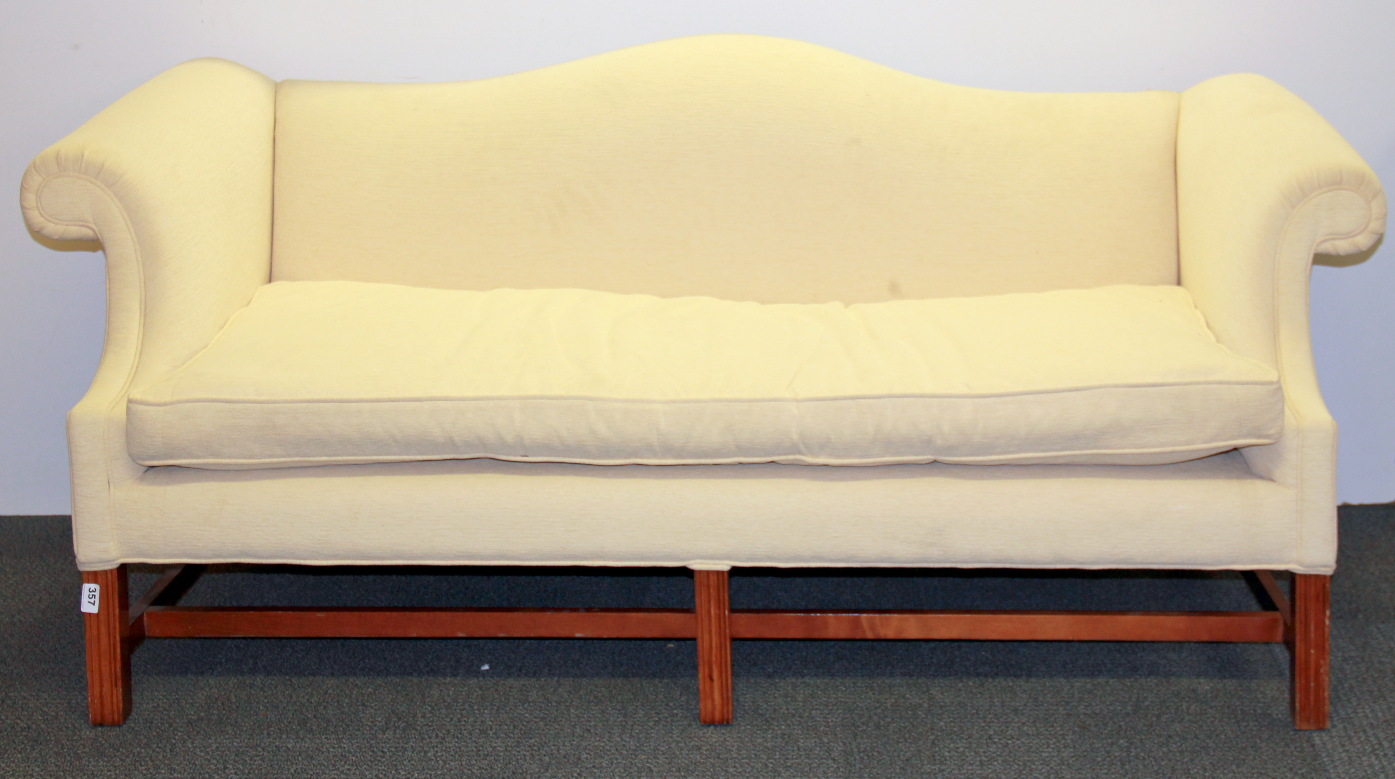 An upholstered mahogany framed couch, L. 186cm.