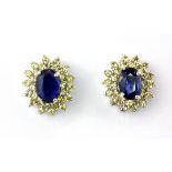 A pair of 925 silver cluster earrings set with oval cut sapphire and white topaz, 3.2 x 3cm.