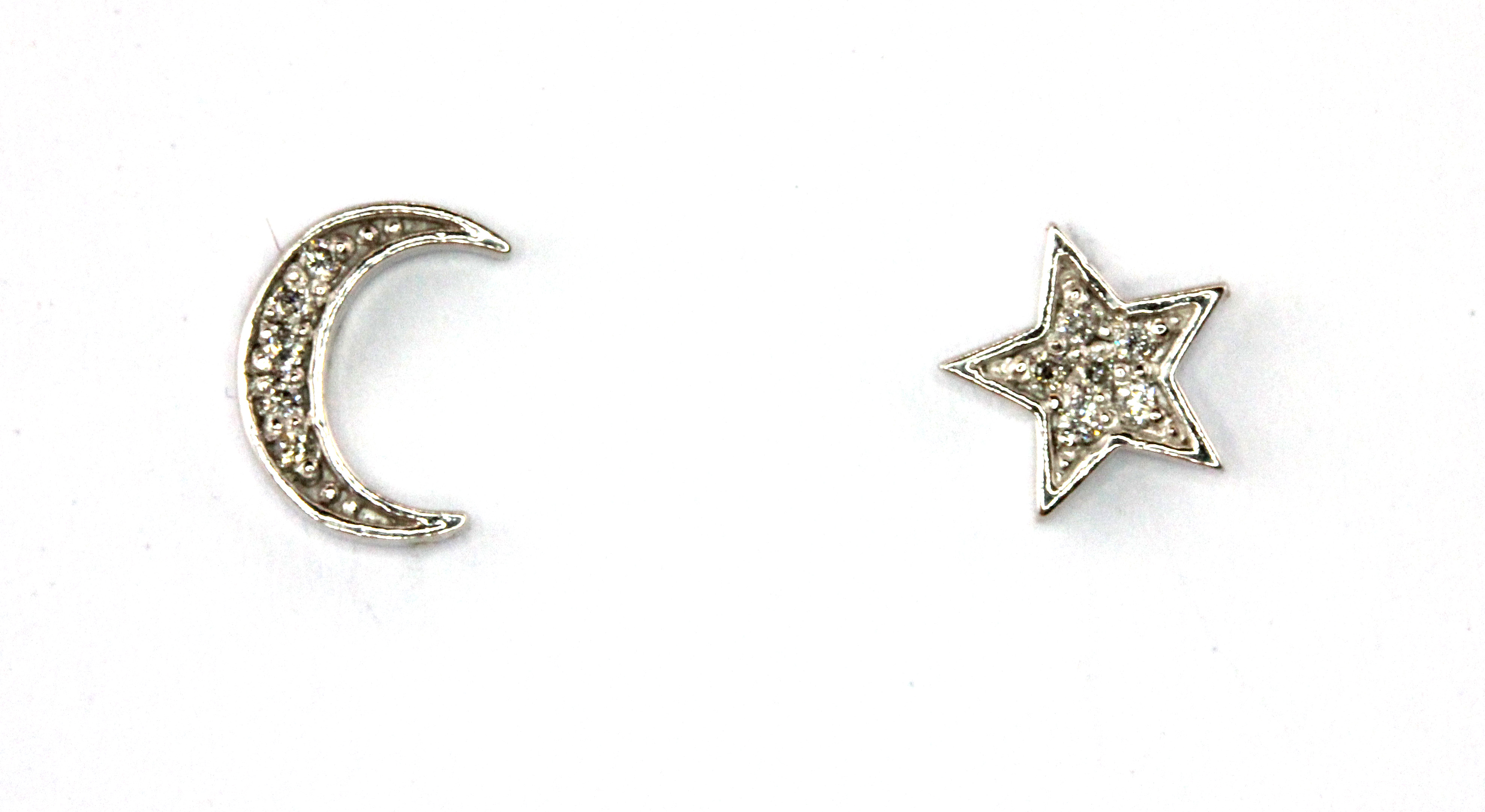 A pair of 18ct white gold diamond set moon and star shaped stud earrings, L. 0.7cm.