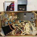 A box of mixed costume jewellery.