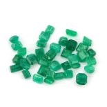 Approximately 35 mixed cut unmounted Columbian emeralds, 20ct overall.
