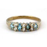 A 9ct yellow gold ring set with marquise cut Swiss blue topaz and white stones, (P).