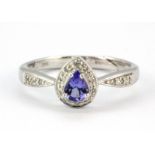 A 9ct white gold ring set with a pear cut tanzanite and diamonds, (a/f), (M.5).