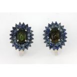 A pair of 925 silver cluster earrings set with a black cabochon cut opal surrounded by two rows of