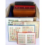 A box of mixed stamp albums.