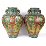 A superb pair of Chinese cloisonne on bronze lobed vases with elephant head handles, H. 33cm.