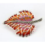 A 925 silver and marcasite enamelled leaf shaped brooch / pendant, L. 4.5 x 3cm.