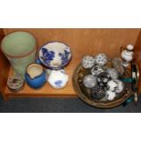 A collection of ceramic carpet bowls and other items.