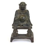 A Tibetan painted cast bronze figure of a seated happy Buddha, H. 16cm.