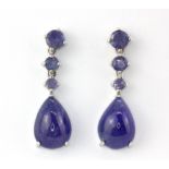 A pair of 925 silver drop earrings set with pear and oval cabochon cut tanzanites, L. 3.2cm.