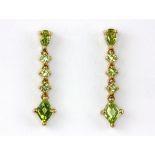 A pair of 9ct yellow gold peridot set drop earrings, L. 2.5cm.