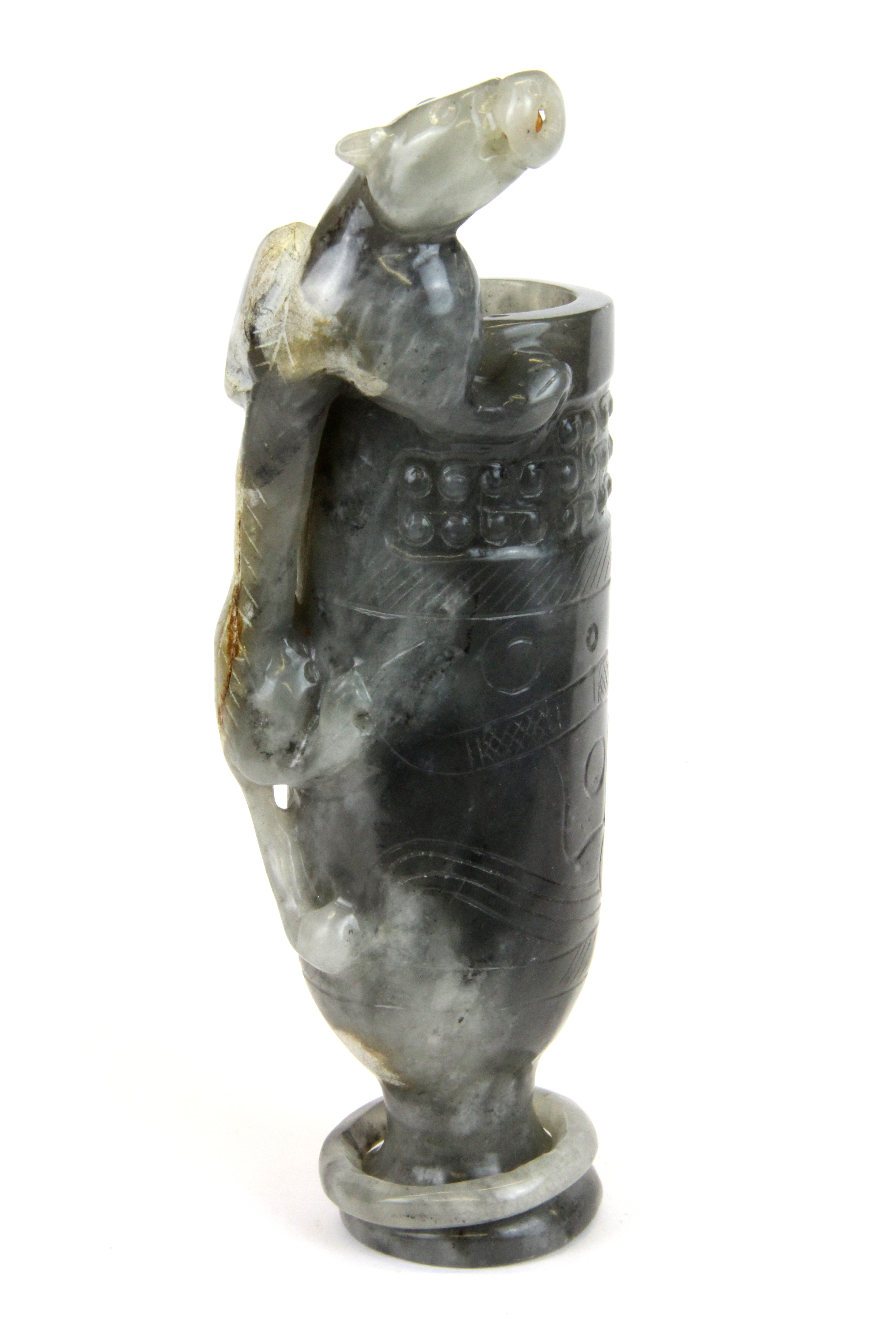 A rare Chinese carved grey jade wine cup with integral ring to foot and a young dragon climbing