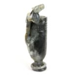 A rare Chinese carved grey jade wine cup with integral ring to foot and a young dragon climbing