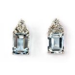 A pair of 18ct white gold (stamped 750) earrings set with baguette cut aquamarines and brilliant cut