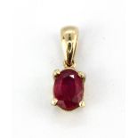 A 9ct yellow gold ruby set pendant, L. 1.5cm.