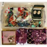 A box of mixed costume jewellery.