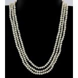 An interesting three row necklace of small cultured pearls on a vintage metal clasp.