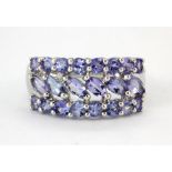 A 9ct white gold ring set with tanzanites, (N).