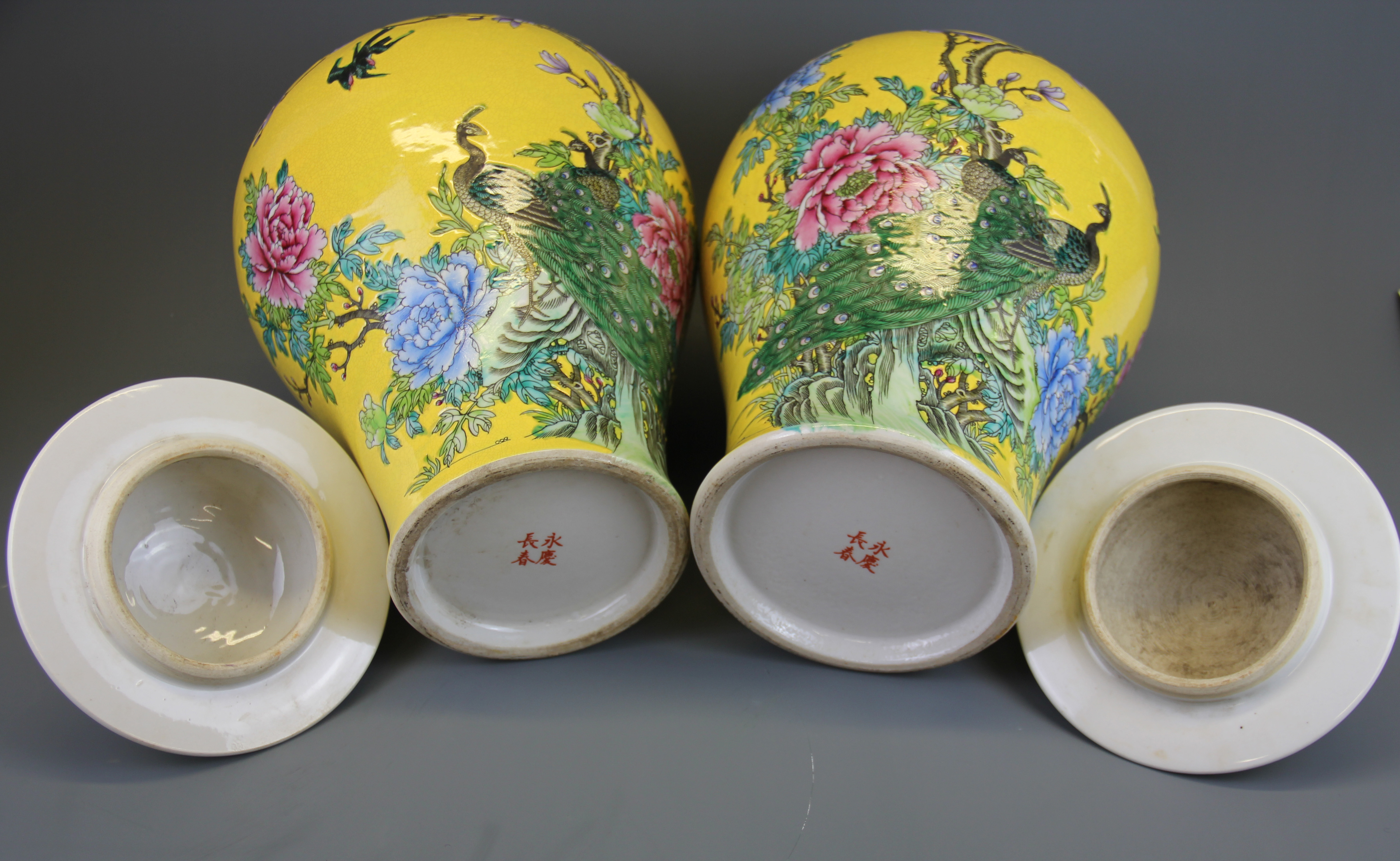 A pair of Chinese mid 20th Century hand enamelled jars and lids decorated with birds and flowers, H. - Image 3 of 3
