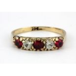 A 9ct yellow gold stone set ring, (K).
