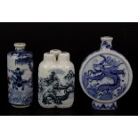 A group of three Chinese porcelain snuff bottles, tallest H. 9cm.