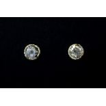 A pair of 18ct yellow gold diamond set stud earrings.