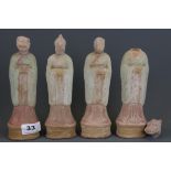 Three Chinese Tang dynasty painted clay figures with animal heads, H. 20cm. Understood to be of