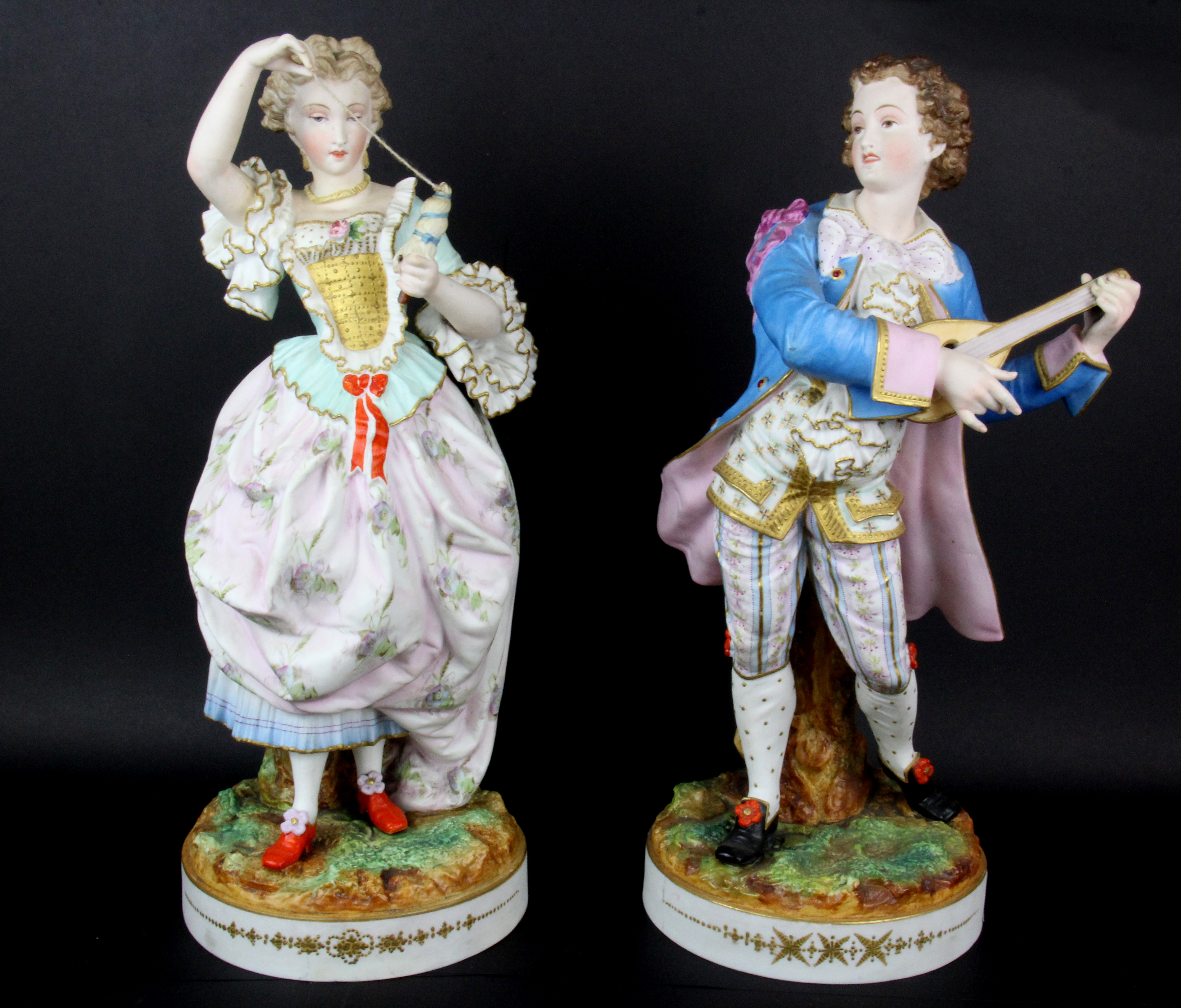 A pair of large 19th Century French hand painted bisque porcelain figurines, H. 39cm.