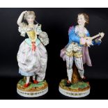 A pair of large 19th Century French hand painted bisque porcelain figurines, H. 39cm.