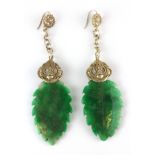 A pair of Chinese carved jade and white metal drop earrings, L. 9cm.
