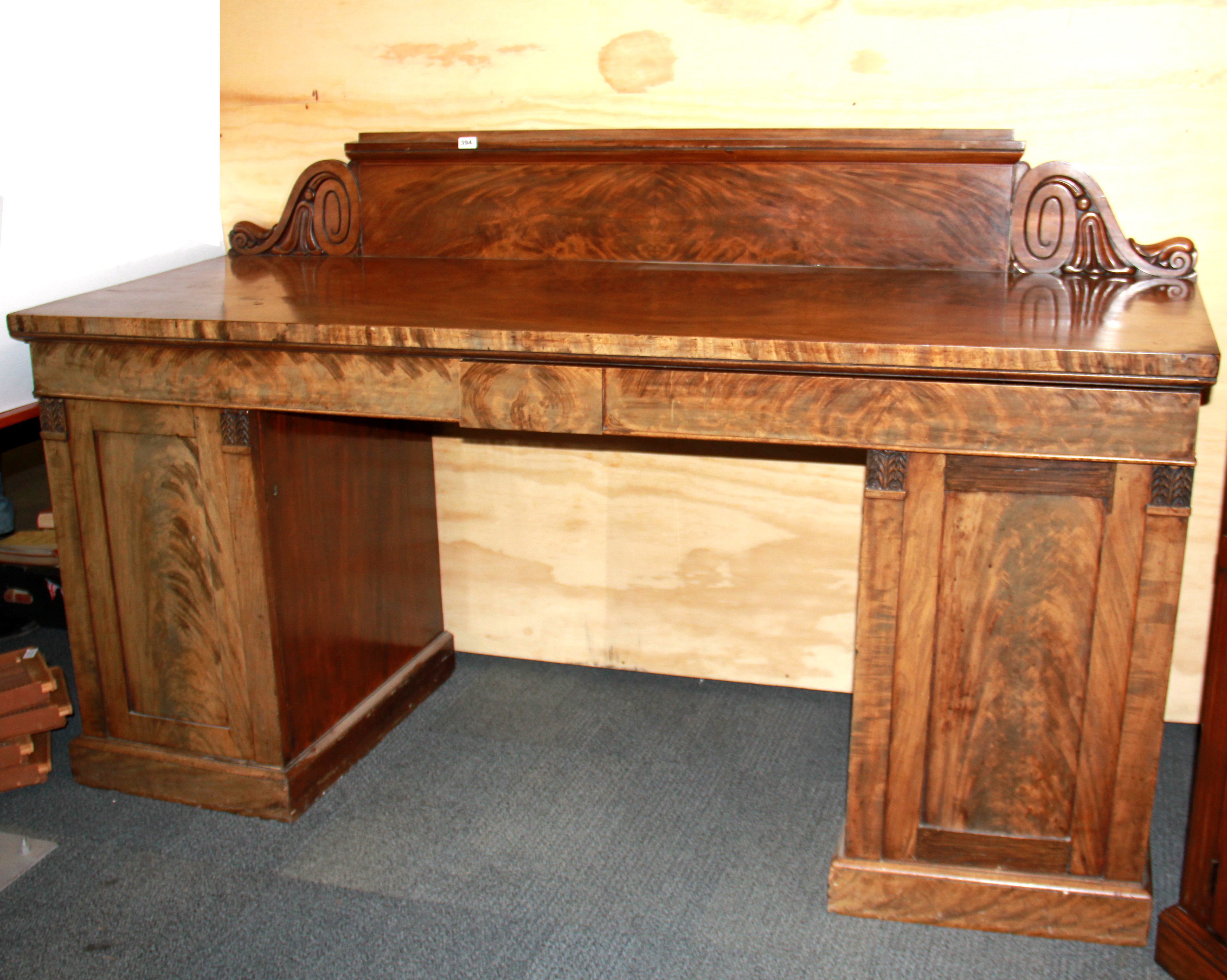 A 19th century mahogany veneered buffet sideboard, W. 198cm H. 122cm.