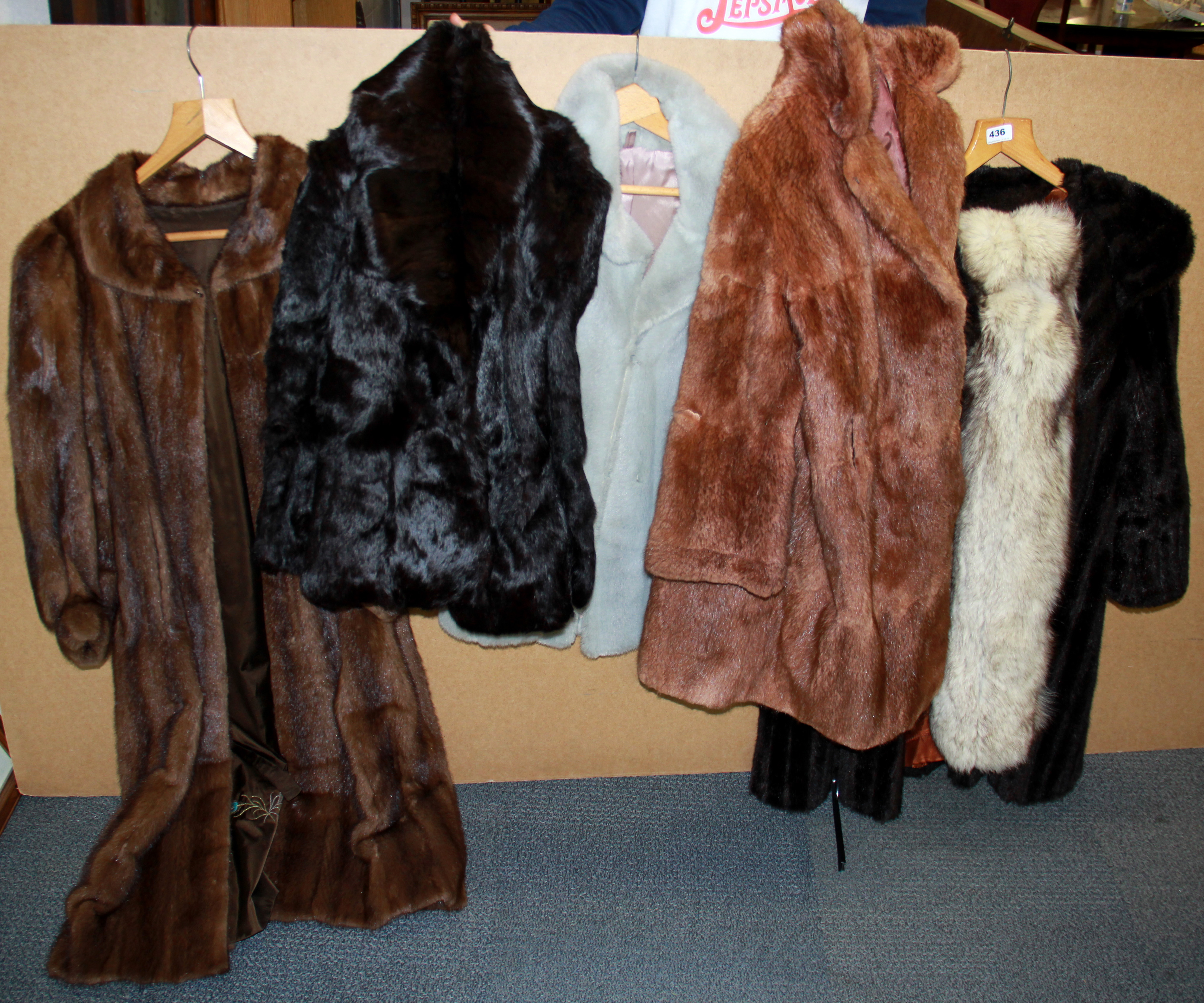 A group of vintage mink and faux fur coats and jackets.