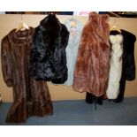 A group of vintage mink and faux fur coats and jackets.